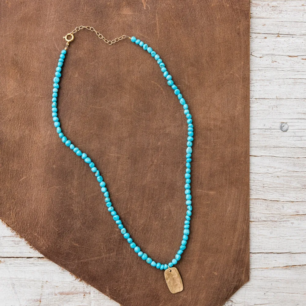 Bronze Tab Necklace on Turquoise Nugget Strand